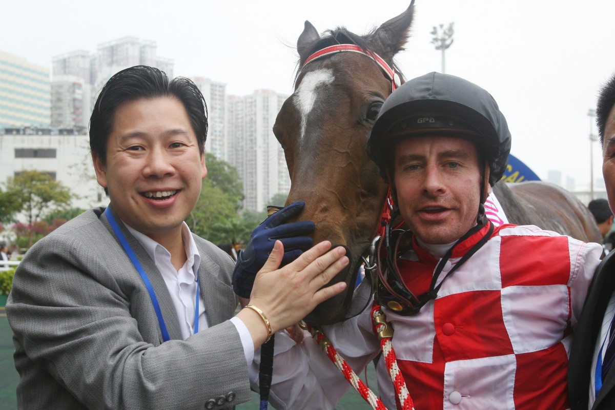 Trainer Dennis Yip celebrates his first Macau Hong Kong Trophy success with Joyful Winner and jockey Eric Saint-Martin in 2009. Photos: Kenneth Chan
