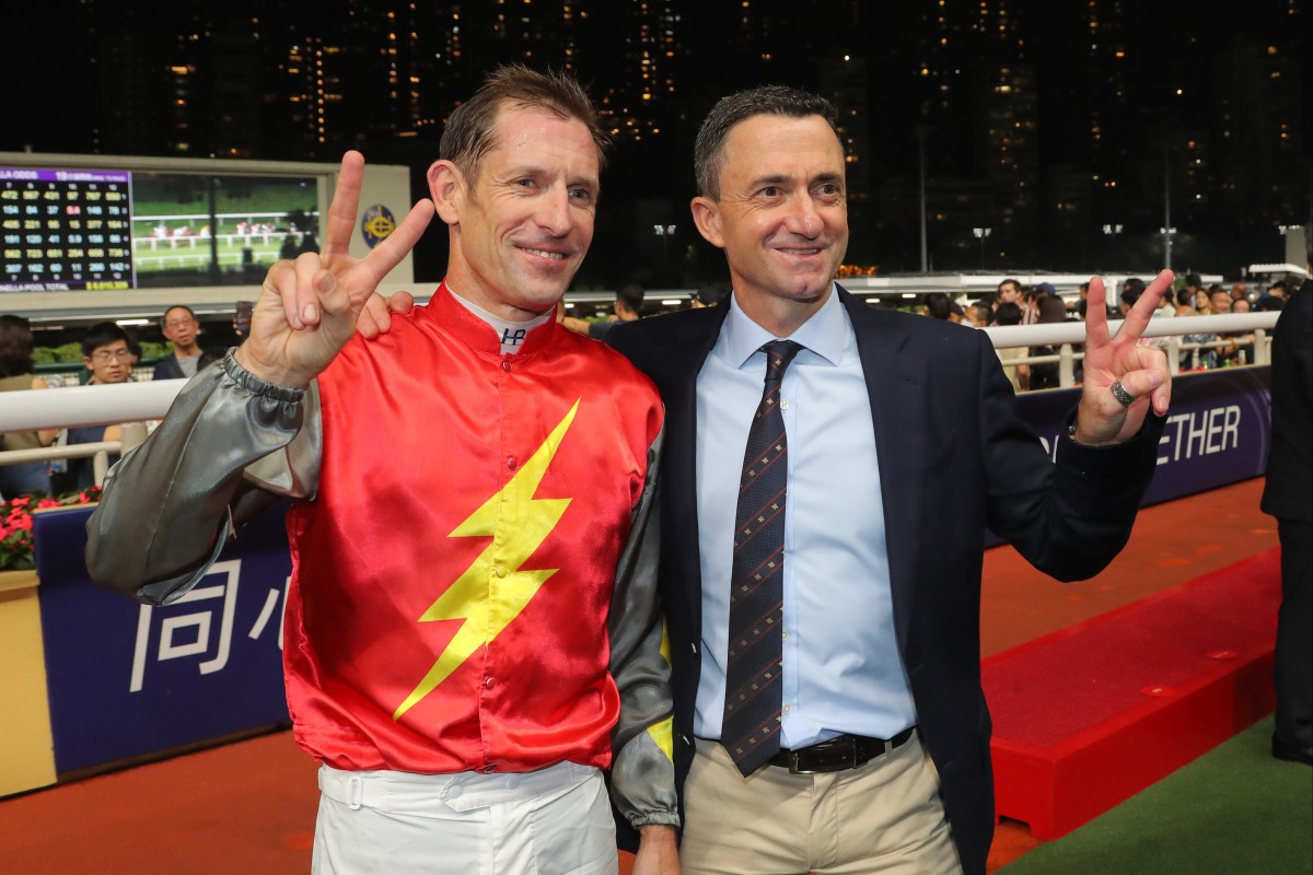 Douglas Whyte celebrates his 200th win as a trainer with Hugh Bowman after Majestic Knight’s Happy Valley triumph. Photos: Kenneth Chan