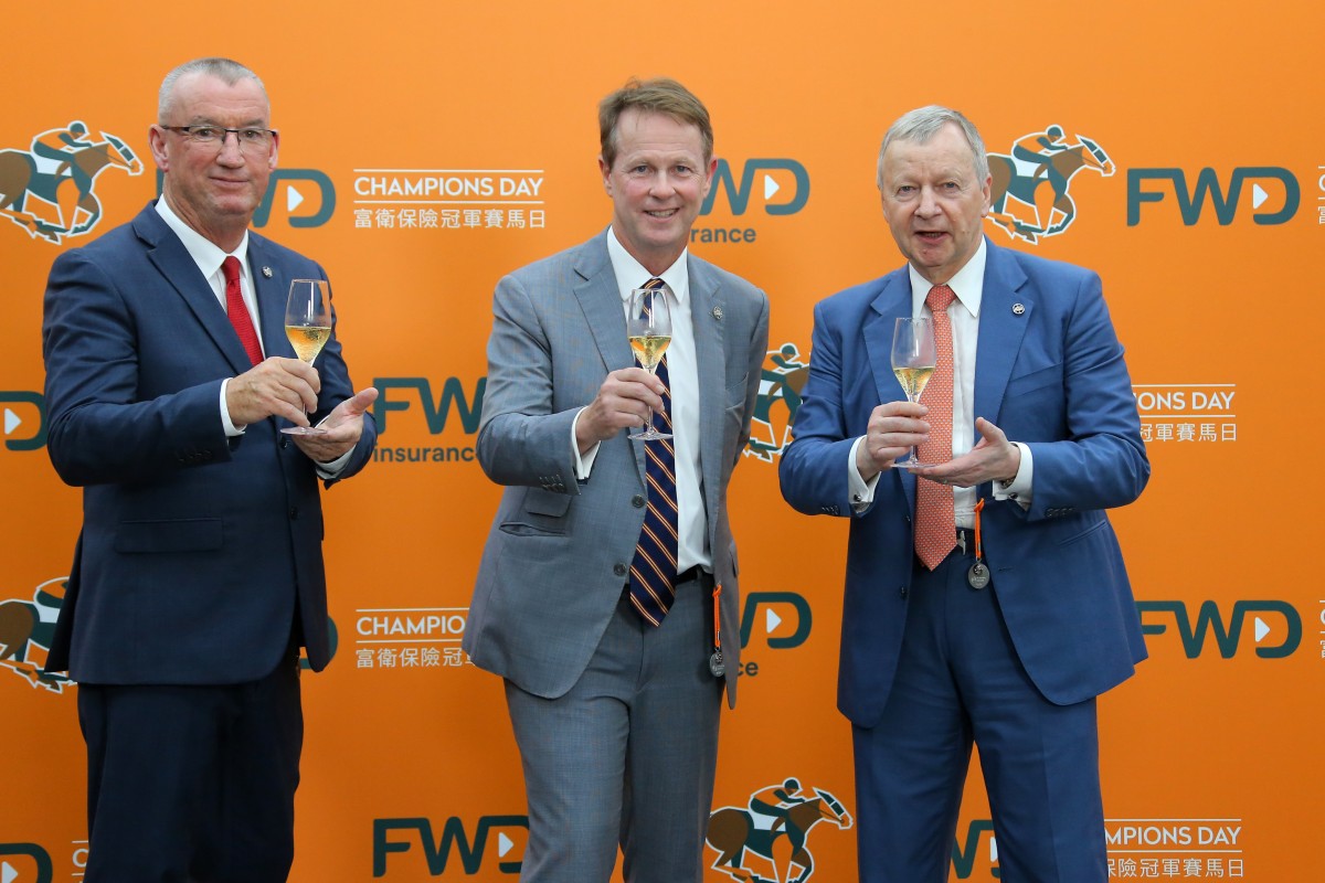 Jockey Club officials Greg Carpenter (left), Andrew Harding and Winfried Engelbrecht-Bresges toast Champions Day. Photos: Kenneth Chan