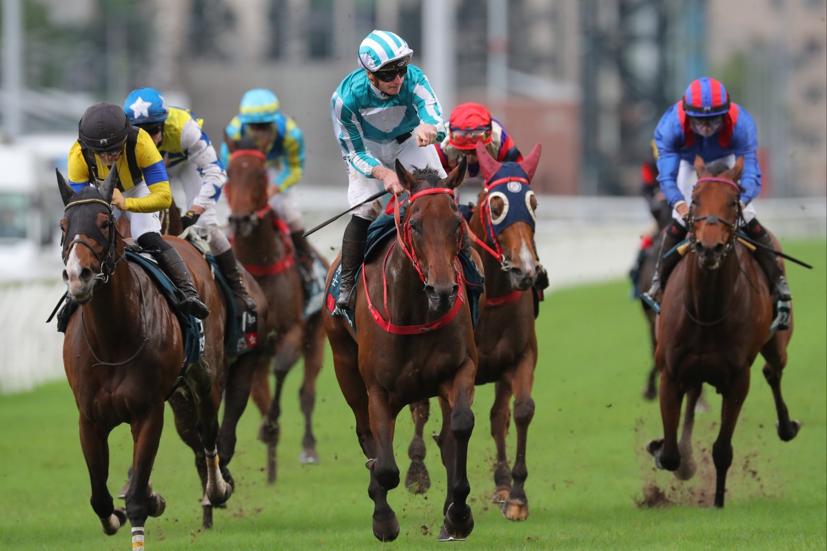 Romantic Warrior (centre) scores a sensational win in the QE II Cup under James McDonald. Photos: Kenneth Chan