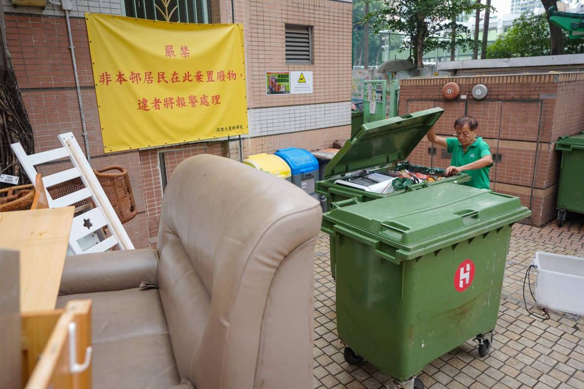 A cleaner surnamed Chung works in Moon Lok Dai Ha, a public housing estate in Tsuen Wan that is included in a trial run of Hong Kong’s waste-charging scheme. Photo: Eugene Lee