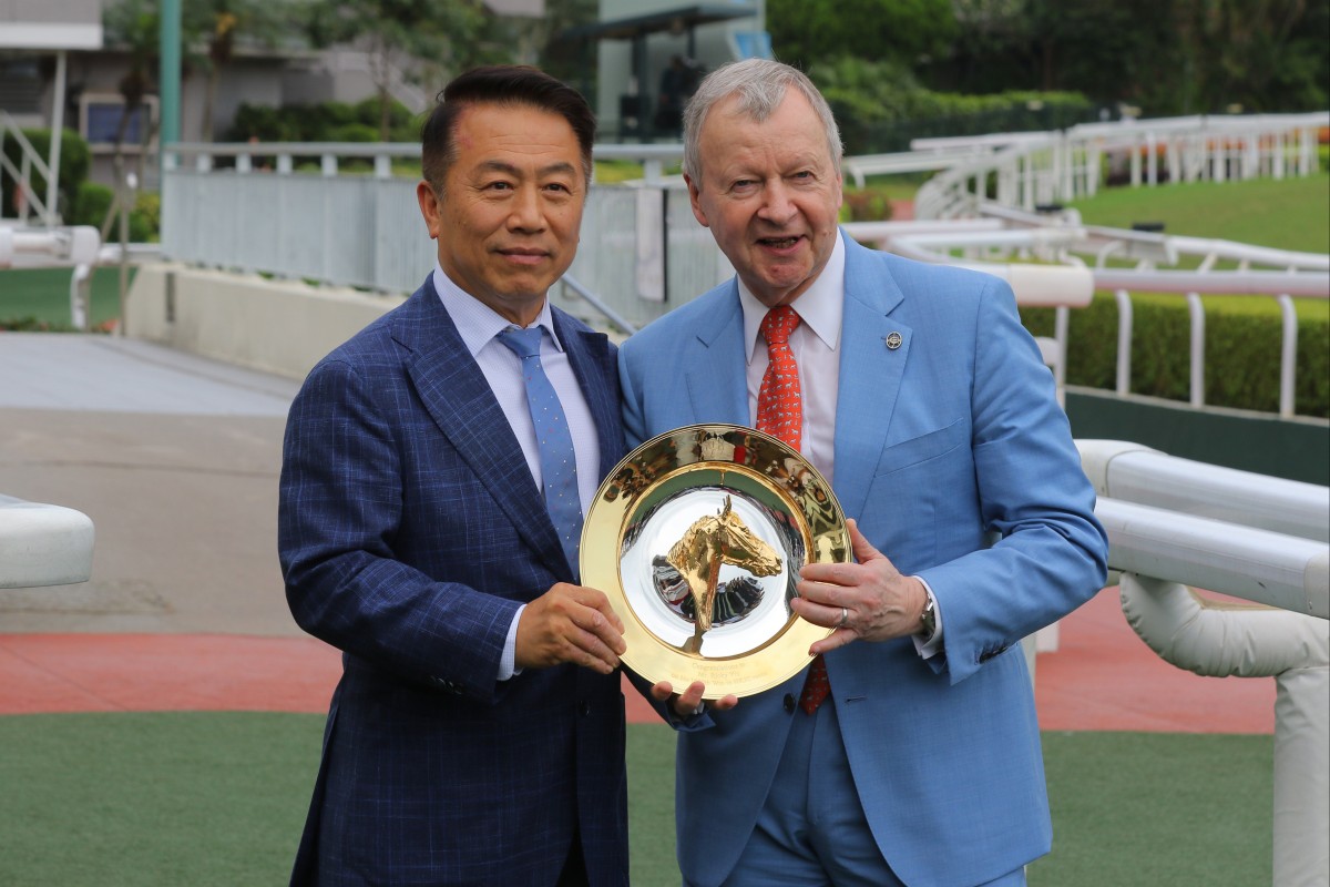 Ricky Yiu celebrates his 1,000th win with Jockey Club CEO Winfried Engelbrecht-Bresges. Photos: Kenneth Chan