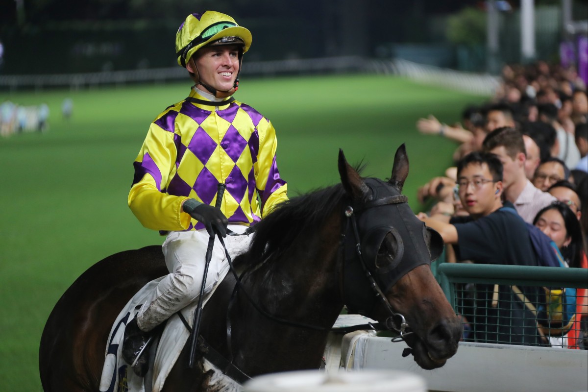 Jockey Ben Thompson is all smiles after Ernest Feeling’s victory at Happy Valley on Wednesday night. Photo: Kenneth Chan