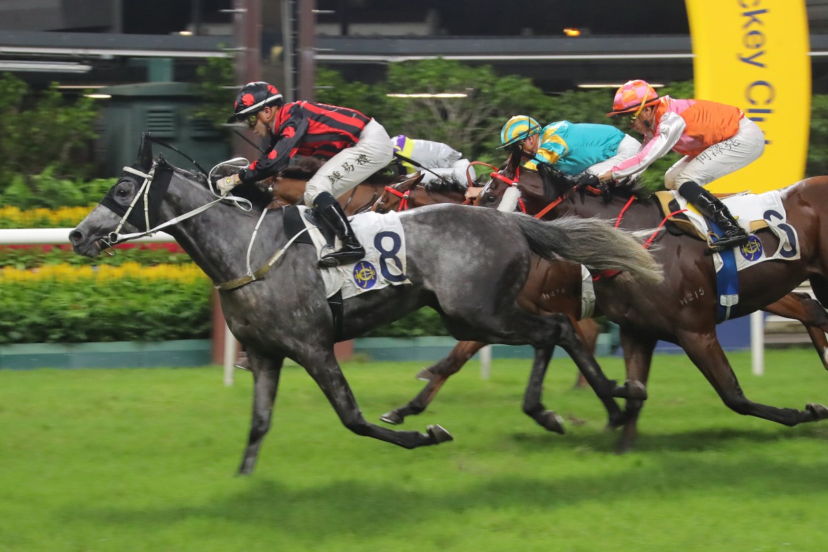 Angus Chung guides Outgate to victory at Happy Valley. Photos: Kenneth Chan