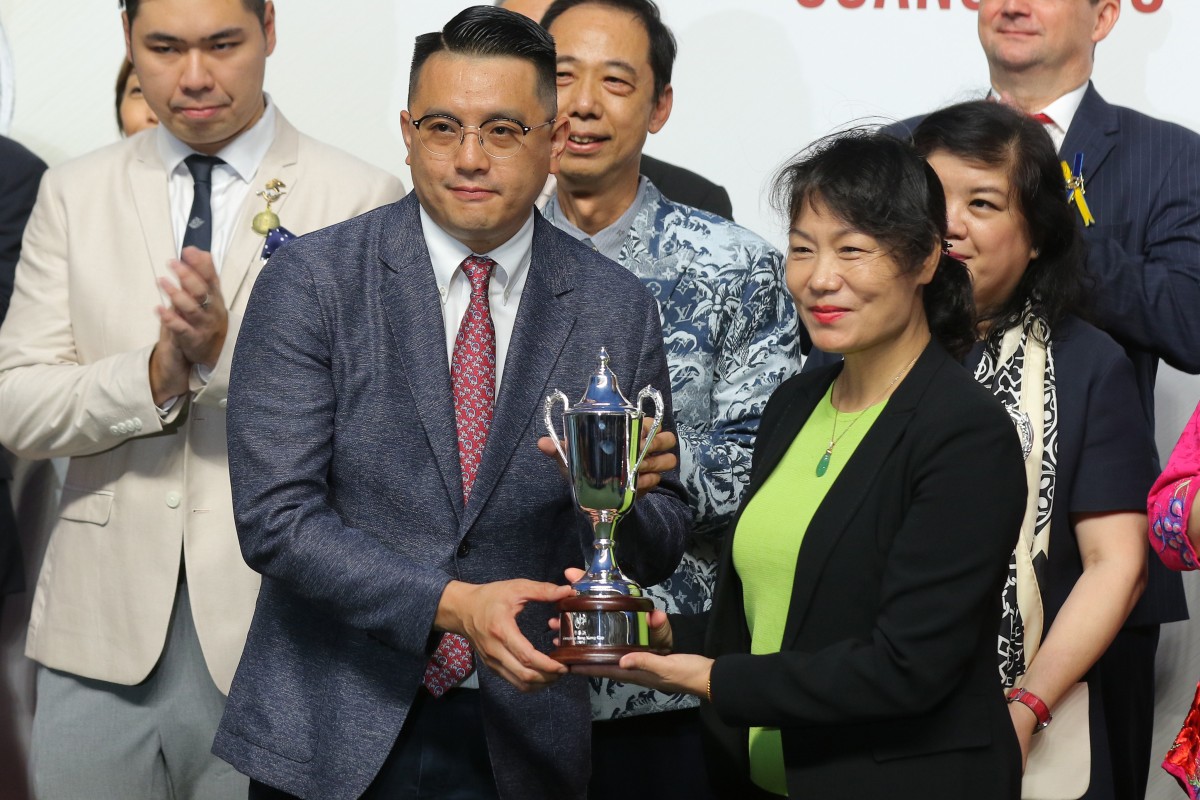 Pierre Ng collects the Guangdong-Hong Kong Cup after Super Bonus’ tough win at Sha Tin. Photos: Kenneth Chan