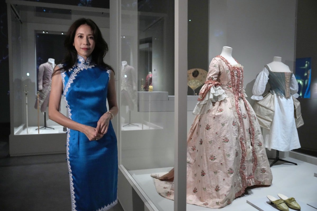 Singer and actress Karen Mok, who narrated the audio guide for the exhibition, poses with a French silk dress dating back to about 1770 at “The Adorned Body: French Fashion and Jewellery 1770–1910” at the Hong Kong Palace Museum. Photo: May Tse