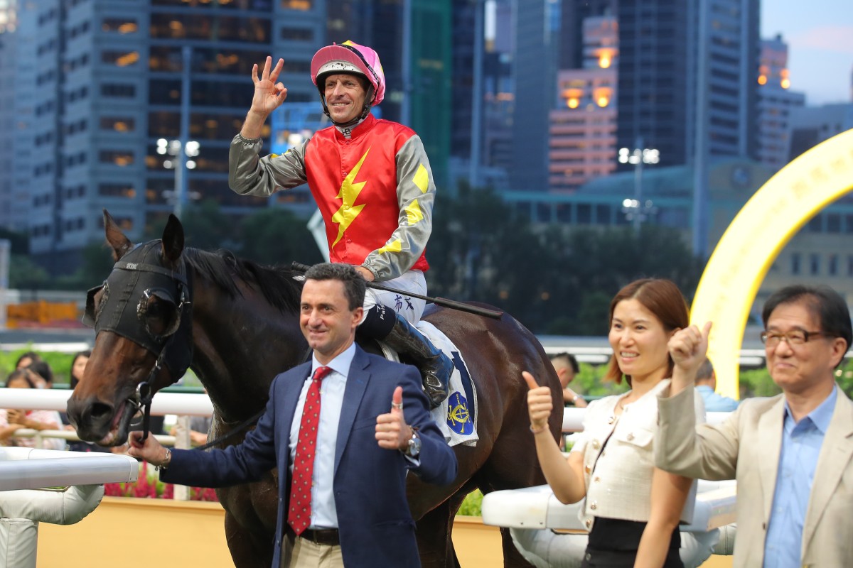 Hugh Bowman, Douglas Whyte and connections celebrate Majestic Knight’s Happy Valley win. Photos: Kenneth Chan