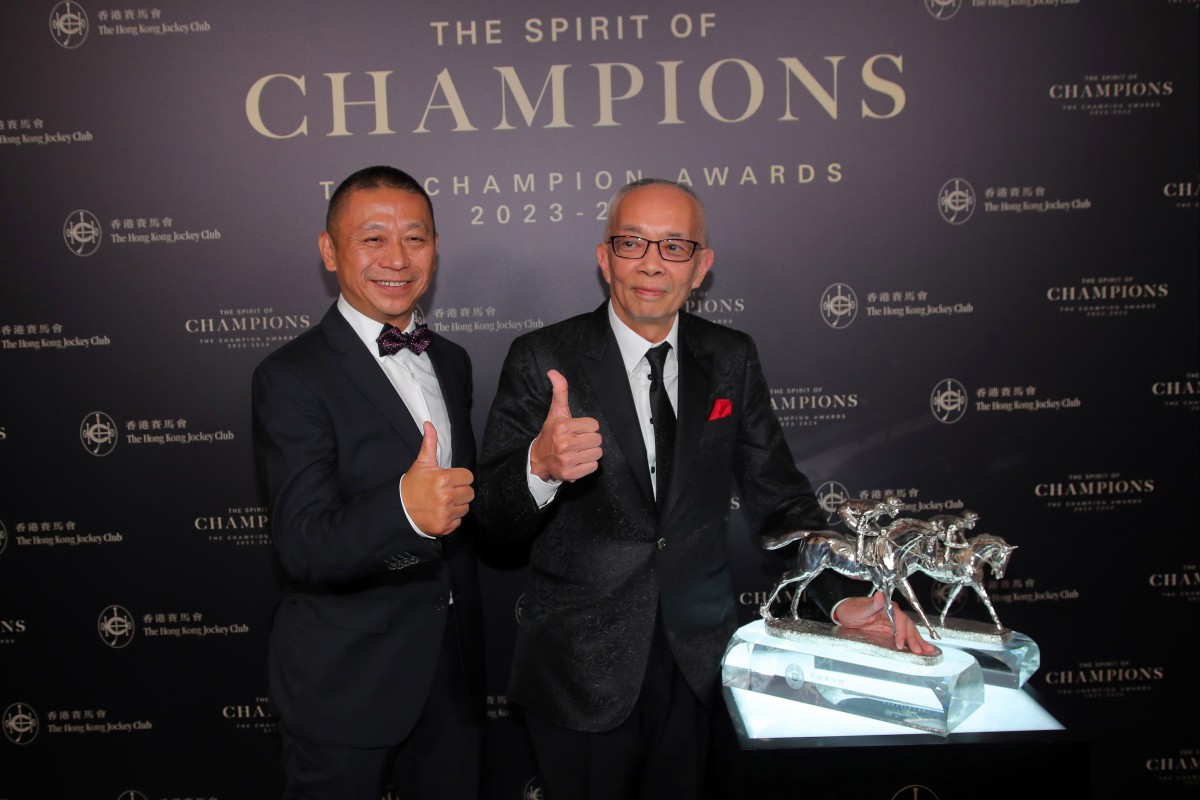 Trainer Danny Shum and owner Peter Lau collect Romantic Warrior’s Horse of the Year gong. Photo: Kenneth Chan