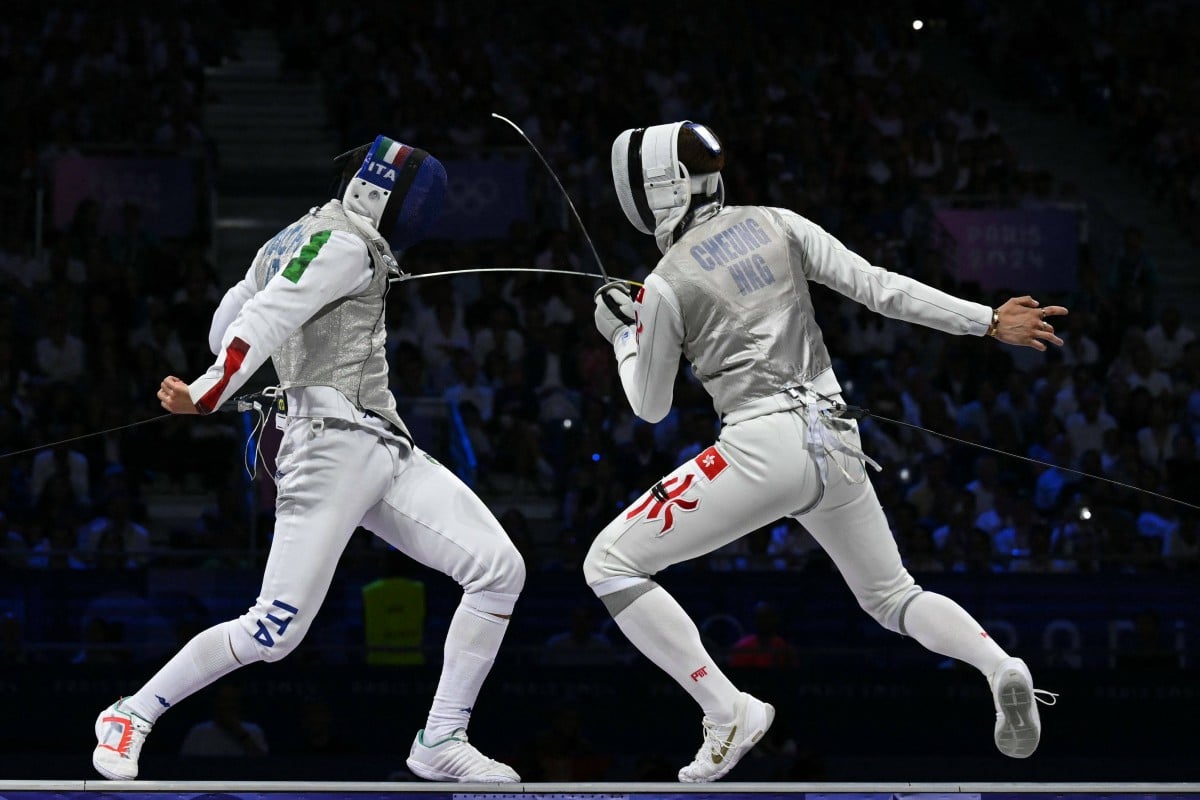 Italy’s Filippo Macchi (left) competes against Hong Kong’s Cheung Ka-long in the men’s foil individual gold medal bout during the Paris 2024 Olympic Games at the Grand Palais in Paris on July 29, 2024. Photo: AFP