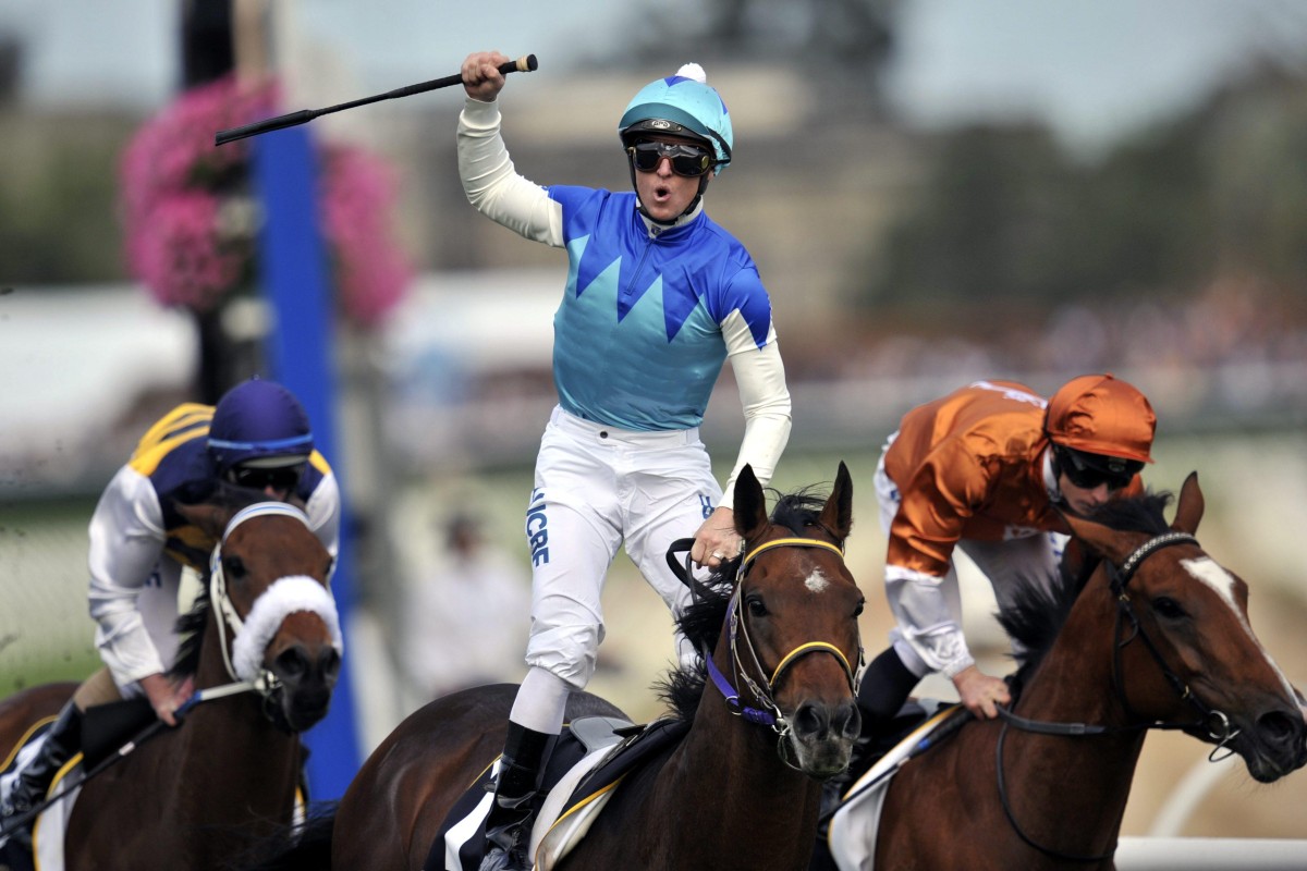 Zac Purton celebrates winning the 2014 Caulfield Cup on Japanese raider Admire Rakti. Photo: EPA