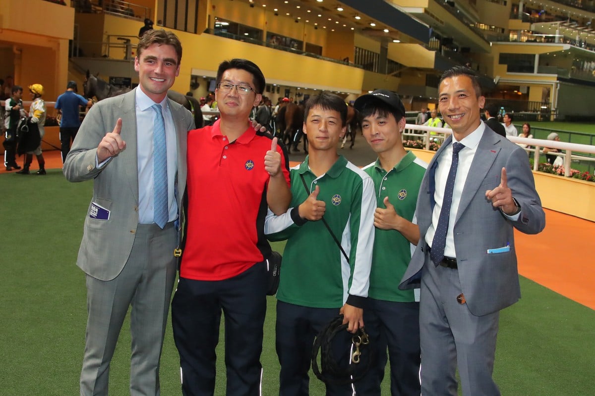 David Eustace (left) celebrates his first Hong Kong victory with stable staff at Happy Valley. Photos: Kenneth Chan