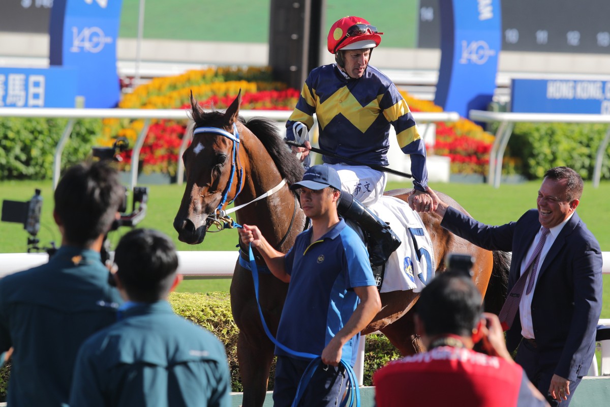 Hugh Bowman and Caspar Fownes celebrate Family Jewel’s latest win at Sha Tin. Photos: Kenneth Chan