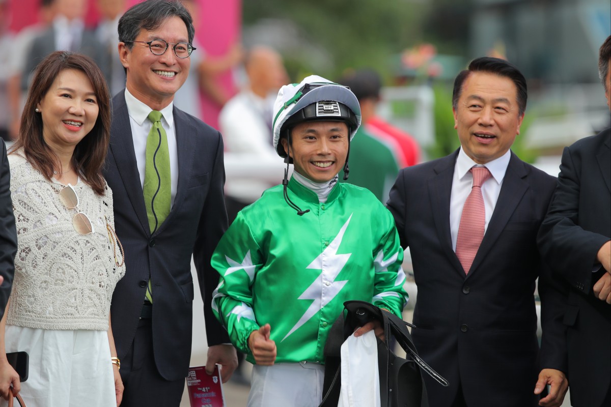 Jockey Matthew Poon, trainer Ricky Yiu (right) and connections celebrate Green N White’s Sha Tin victory. Photos: Kenneth Chan