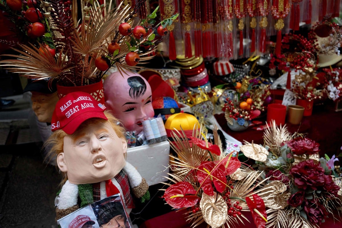 A rubber mask in a market stall in Hong Kong depicting US President Donald Trump, who has promised harsher tariffs on China in his second term. Photo: AFP