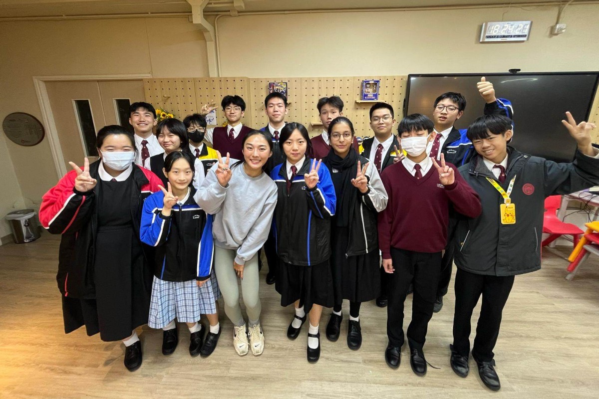 Cecilia Yeung Man-wai with student journalists at Lingnan Dr Chung Wing Kwong Memorial Secondary School. Photo: Handout
