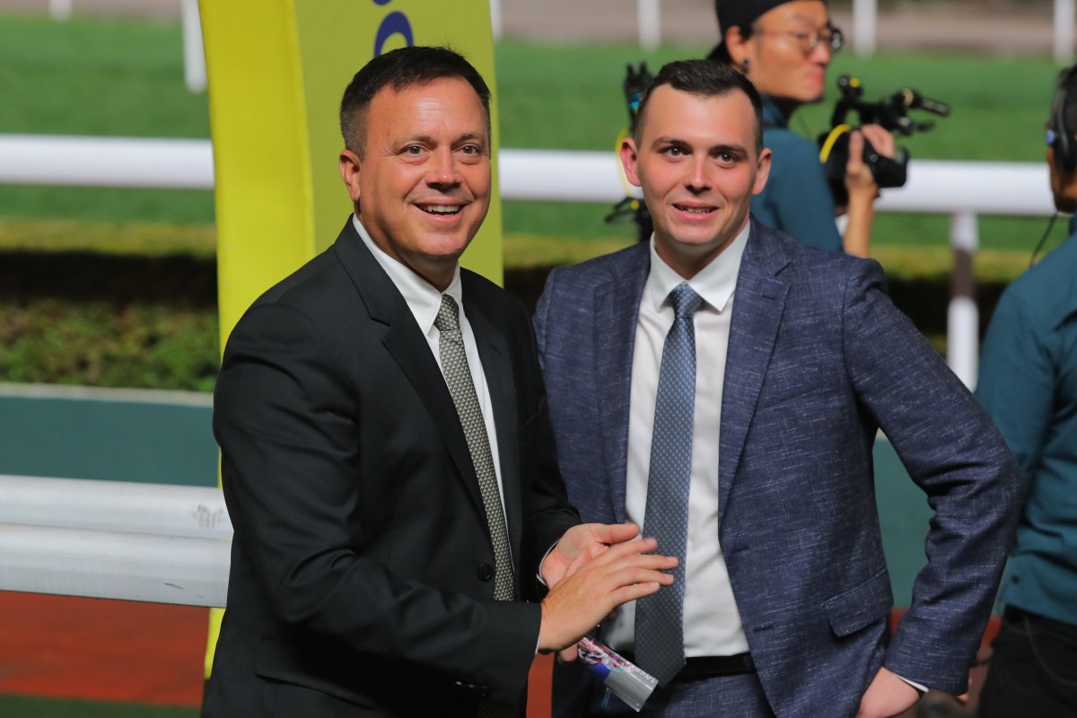 Caspar Fownes enjoys his treble with son Ronan. Photo: Kenneth Chan