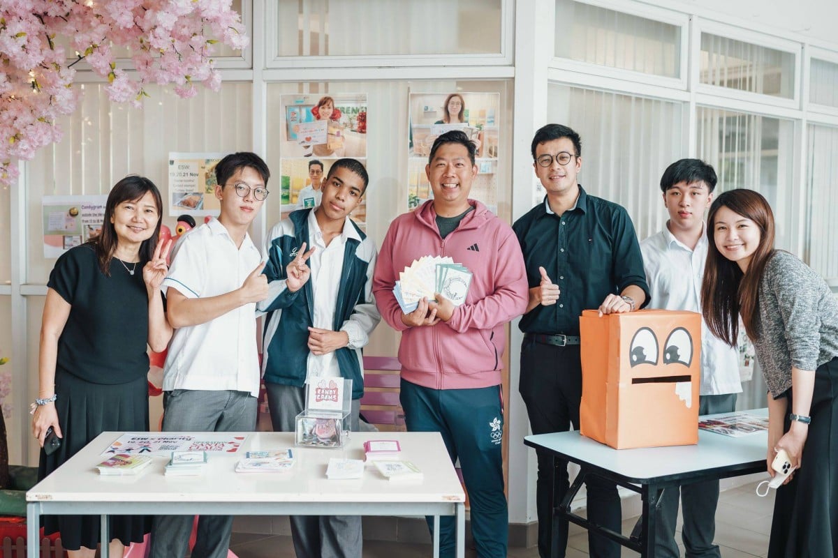 Teachers and English ambassadors sell candygram cards to raise money for Operation Santa Claus at Cumberland Presbyterian Church Yao Dao Secondary School in Yuen Long. Photo: Handout