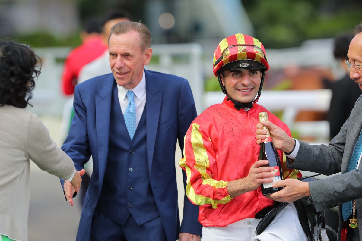 Jockey Andrea Atzeni celebrates his win on Lifeline Express with trainer John Size and connections. Photos: Kenneth Chan