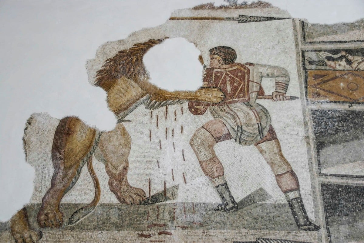 An ancient Roman mosaic at the Bardo National Museum in Tunis, Tunisia depicts a specialist gladiator, called a venator, confronting a lion. Photo: Reuters