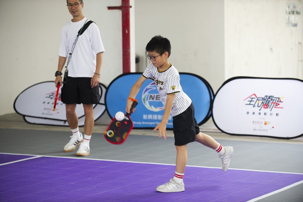 To play pickleball, you just need paddles, a court and a wiffle ball. Photo: Handout