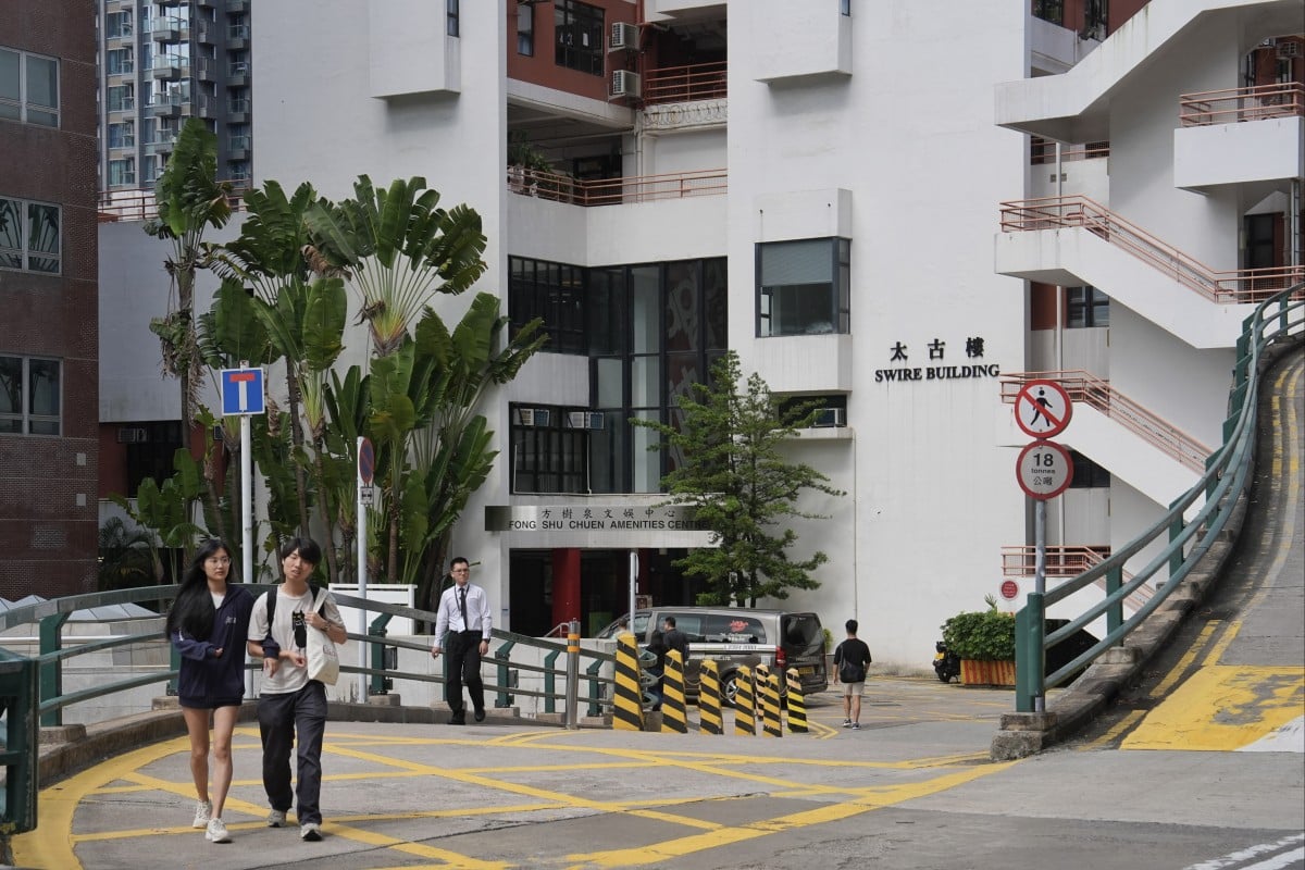 Students walk outside the Swire Building, a student residence at the University of Hong Kong. Photo: Elson Li