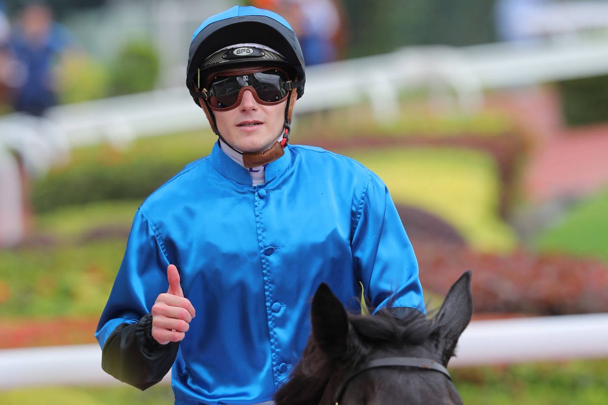 Luke Ferraris gives a thumbs up after winning aboard Dazzling Fit. Photo: Kenneth Chan