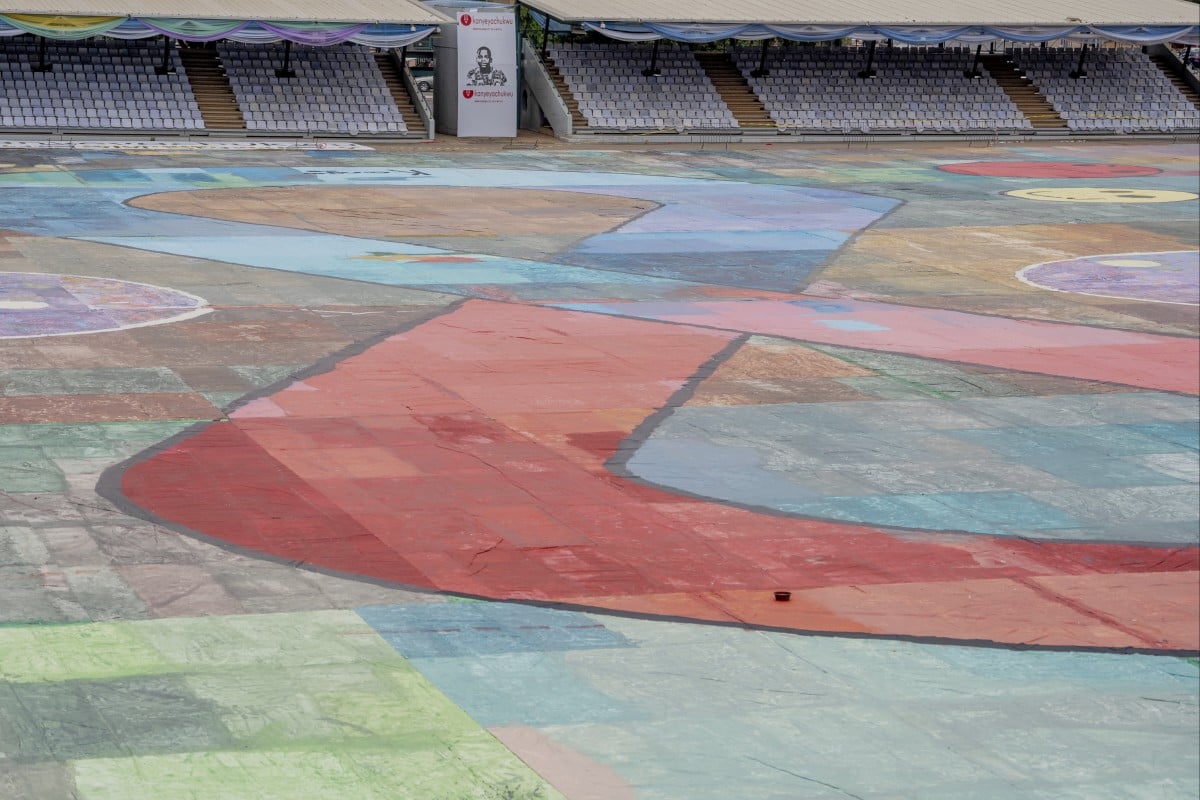 Nigerian teen Kanyeyachukwu Tagbo-Okeke sets a Guinness World Record with a massive art canvas, raising autism awareness and inspiring hope. Photo: AP