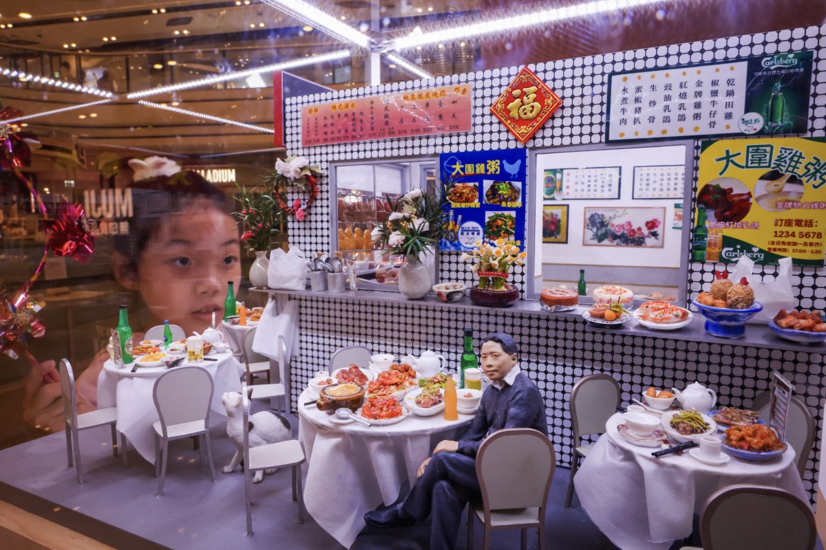 A girl admires a miniature model of Tai Wai Chicken Congee displayed at a shopping mall. Tai Wai is renowned for its diverse street snacks. Photo: Nora Tam