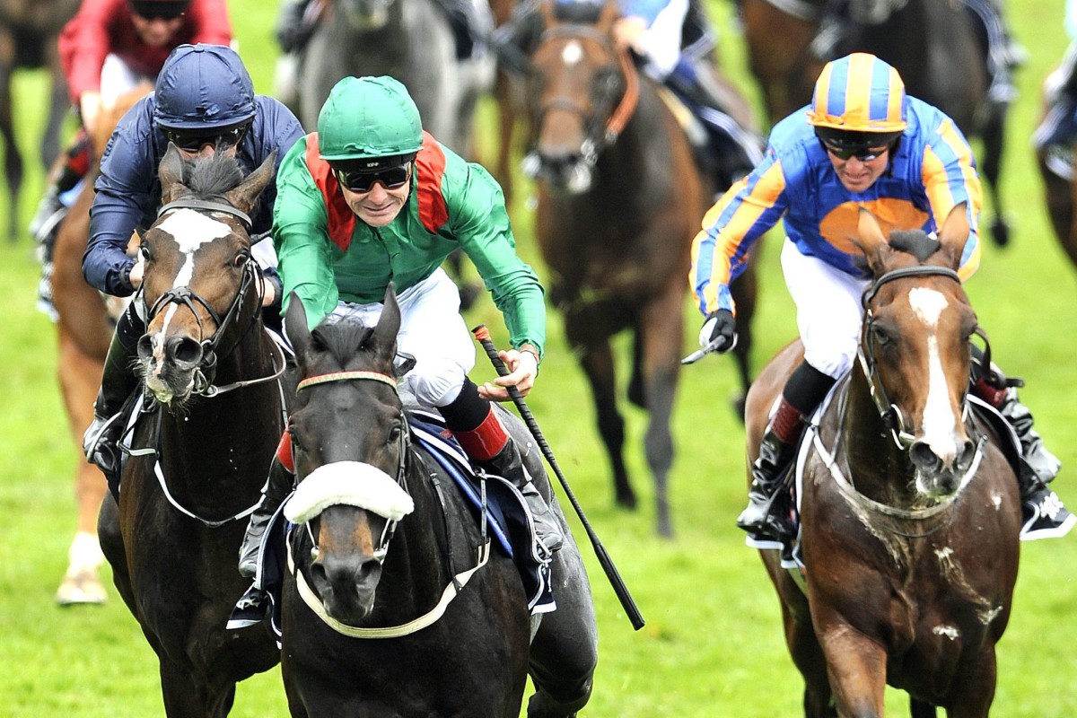 Harzand (centre) wins the 2016 Epsom Derby for the Aga Khan. Photo: EPA