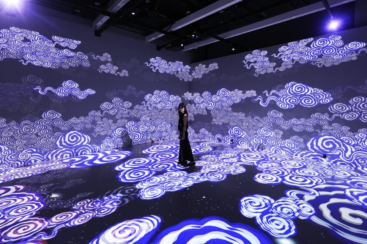 A projection of clouds is seen at the section, Profusion of Lights and Colours, part of “The Ways in Patterns: An Immersive Digital Exhibition from the Palace Museum”. Photo: Eugene Lee