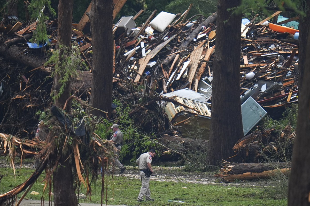 Officials comb through the banks of the Guadalupe River after a flash flood swept through the area on July 5, 2025, in Hunt, Texas. Photo: AP