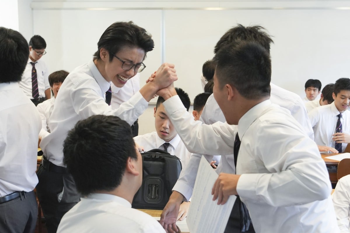 Students at La Salle College in Kowloon Tong react to their DSE results on Wednesday morning. Photo: Sun Yeung