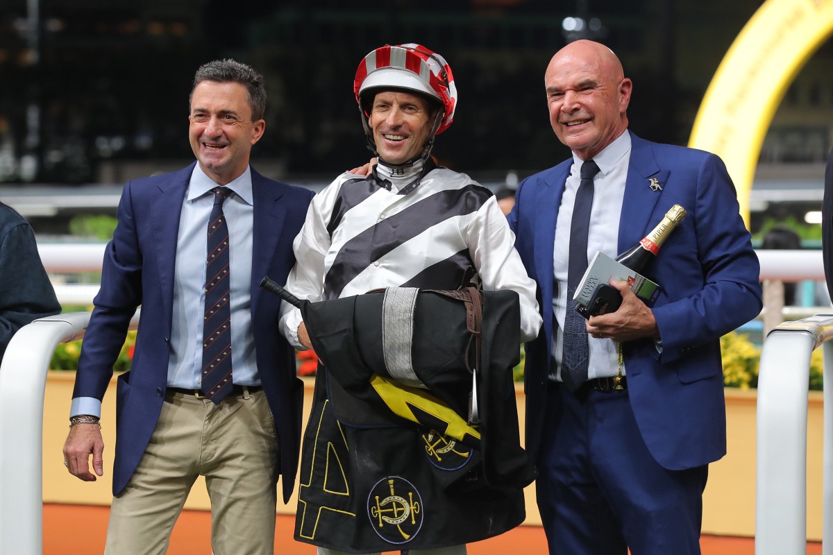 Trainer Douglas Whyte, jockey Hugh Bowman and owner David Boehm celebrate Dan Attack’s Happy Valley win. Photos: Kenneth Chan