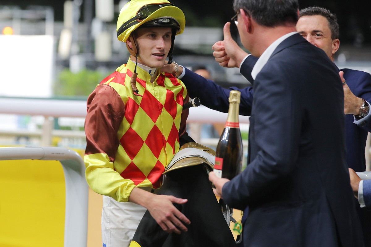 Jockey Luke Ferraris earns the approval of connections after saluting aboard Harmony Fire on Wednesday night. Photo: Kenneth Chan