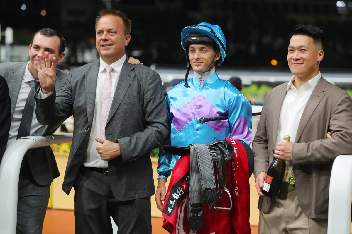 Trainer Caspar Fownes (second from left) celebrates his Happy Valley four-timer with son Ronan (left), jockey Harry Bentley and connections of Lo Rider. Photos: Kenneth Chan
