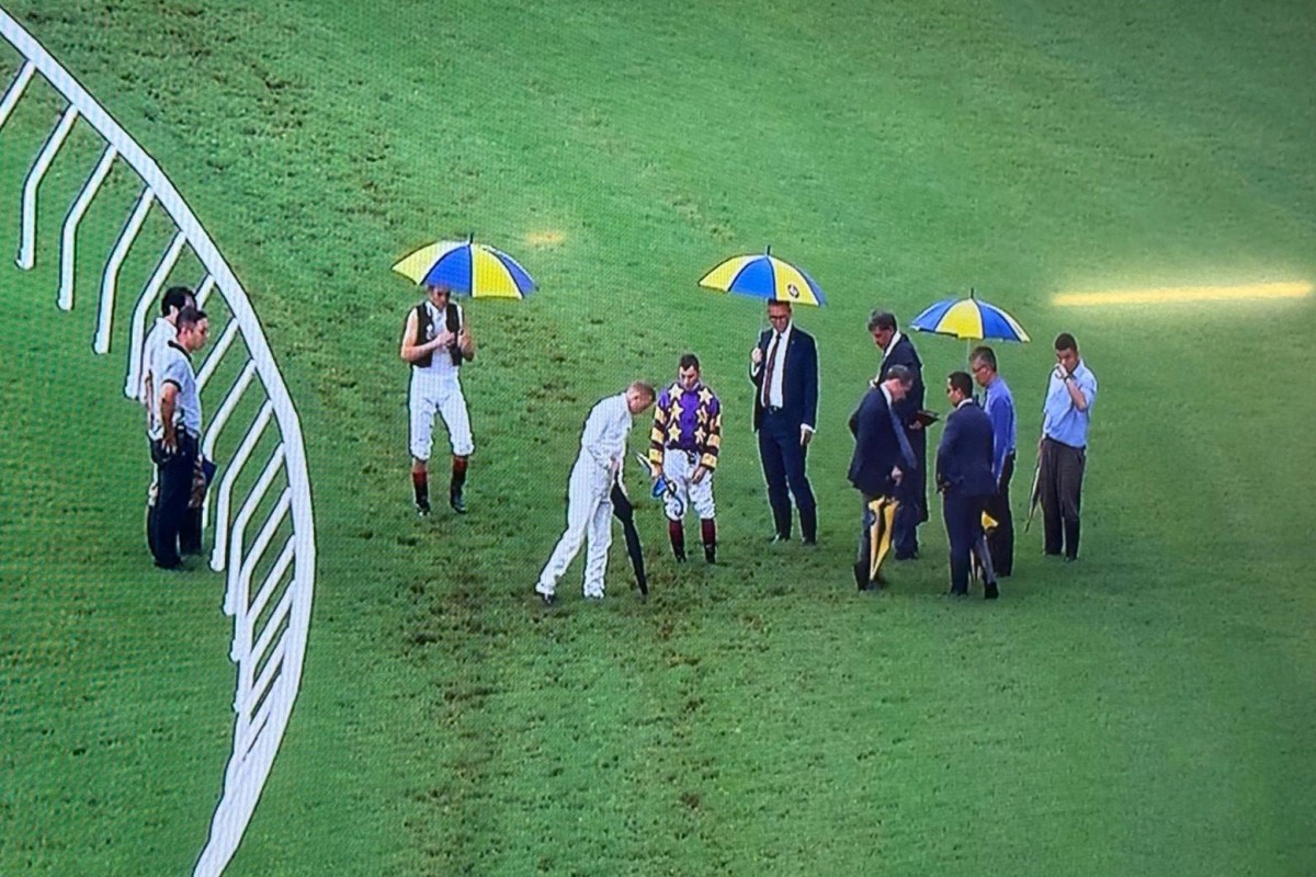 Jockeys and officials inspect the Sha Tin track on Sunday. Photos: Kenneth Chan