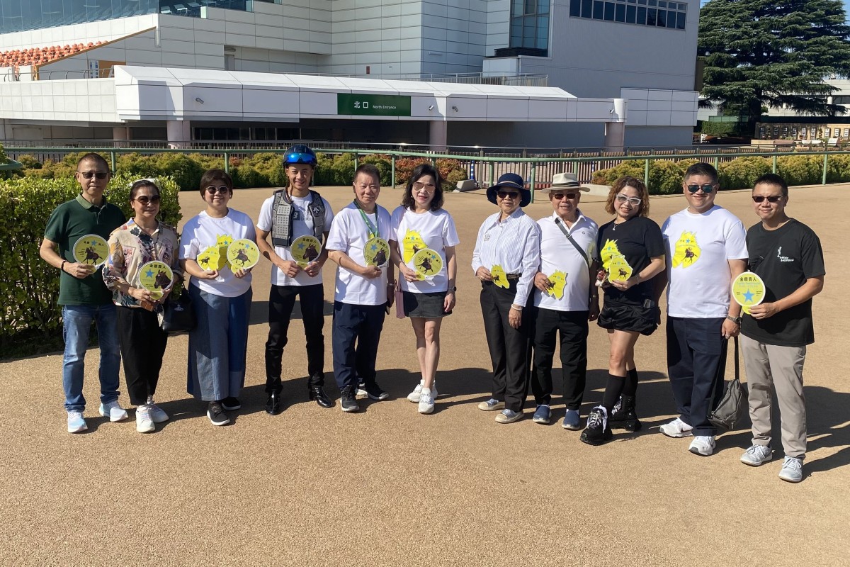 Jockey Derek Leung, trainer Manfred Man (fifth from left) and Lucky Sweynesse’s owners, the Cheng family, at Nakayama racecourse. Photo: Jay Rooney