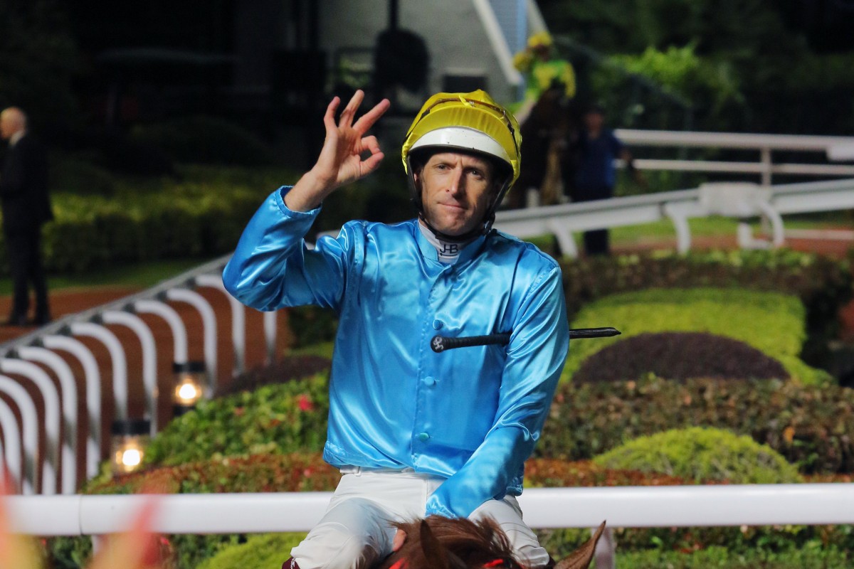 Hugh Bowman salutes after winning aboard Wunderbar last season. Photos: Kenneth Chan