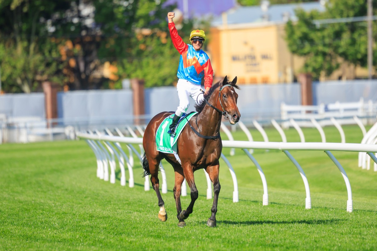 A euphoric Zac Purton punches the air after winning The Everest aboard Ka Ying Rising. Photos: HKJC