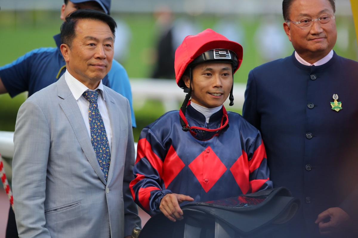 Jockey Matthew Poon, trainer Ricky Yiu (left) and connections celebrate Gracious Express’ win. Photos: Kenneth Chan