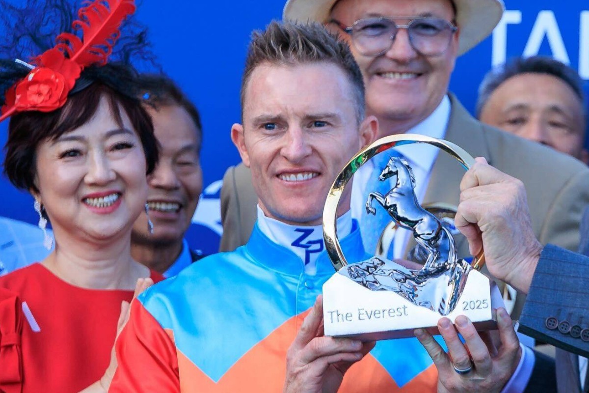Jockey Zac Purton with his The Everest trophy. Photo: HKJC