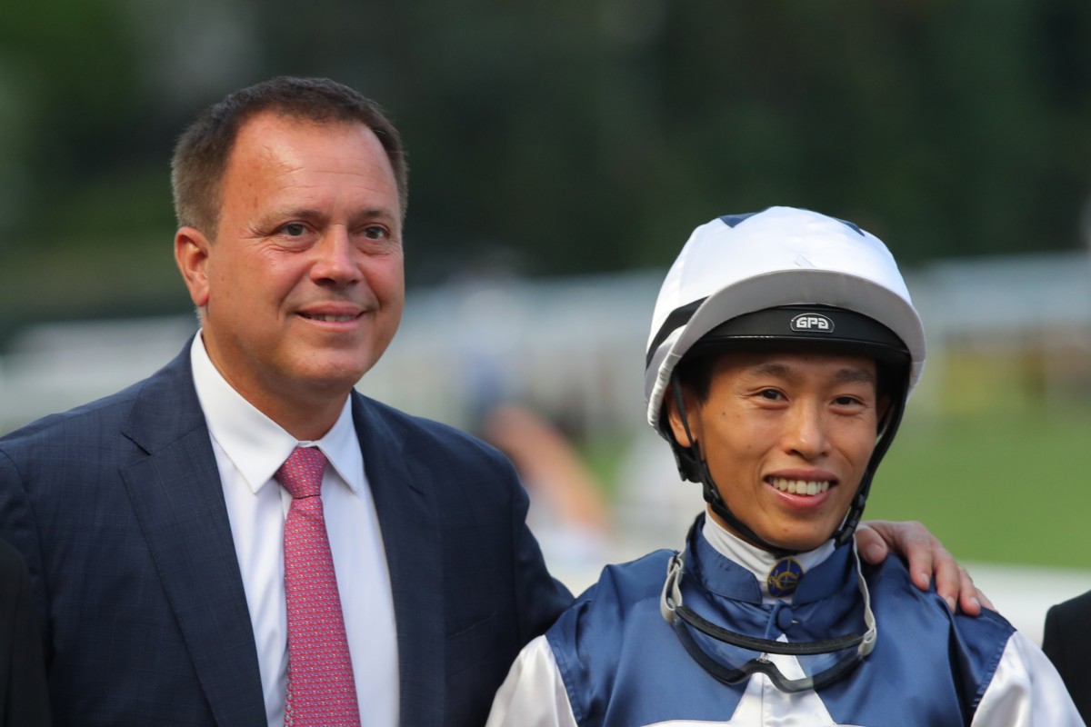 Trainer Caspar Fownes and jockey Vincent Ho are all smiles after Alpha Strike’s victory. Photos: Kenneth Chan