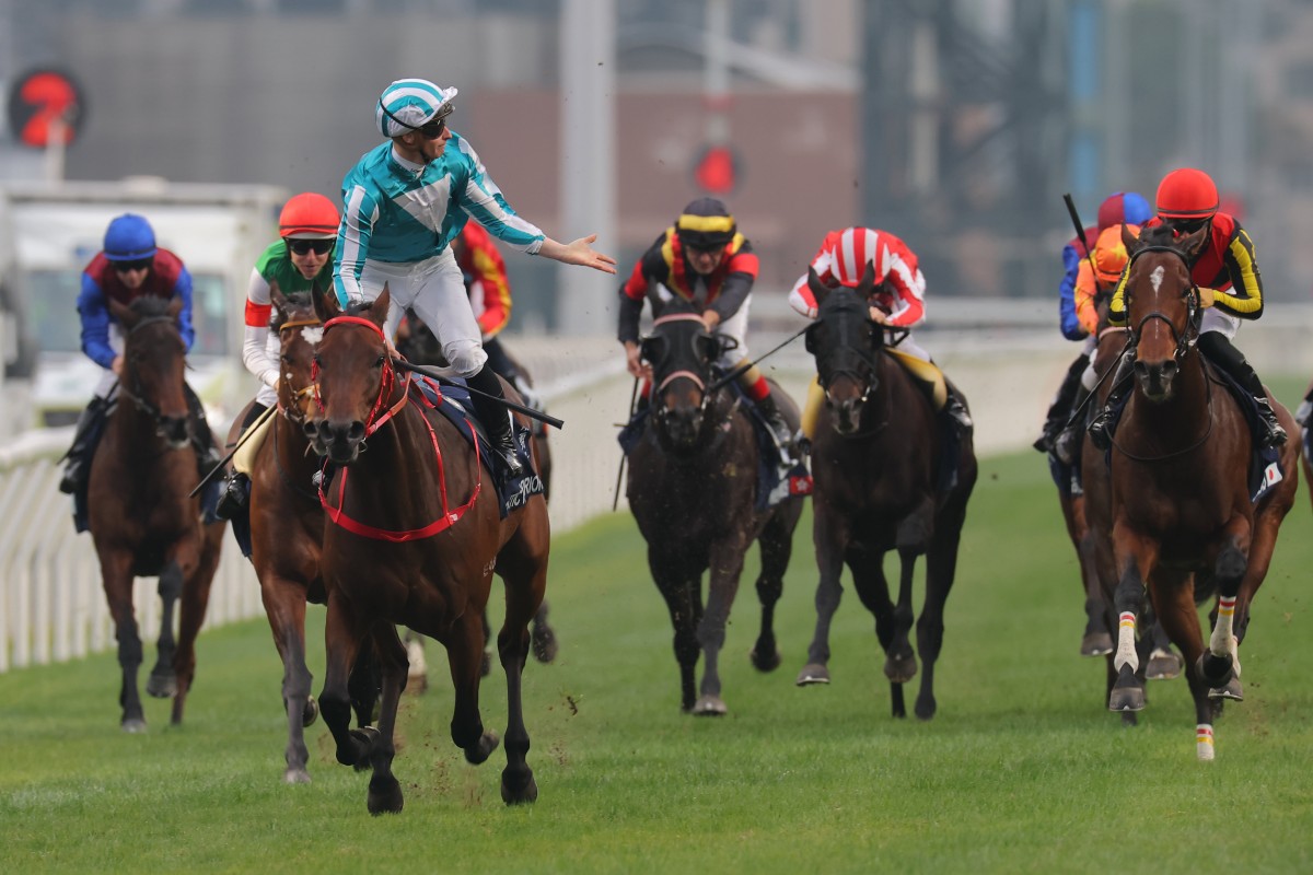James McDonald laps it up as Romantic Warrior secures a third Hong Kong Cup success. Photo: Kenneth Chan