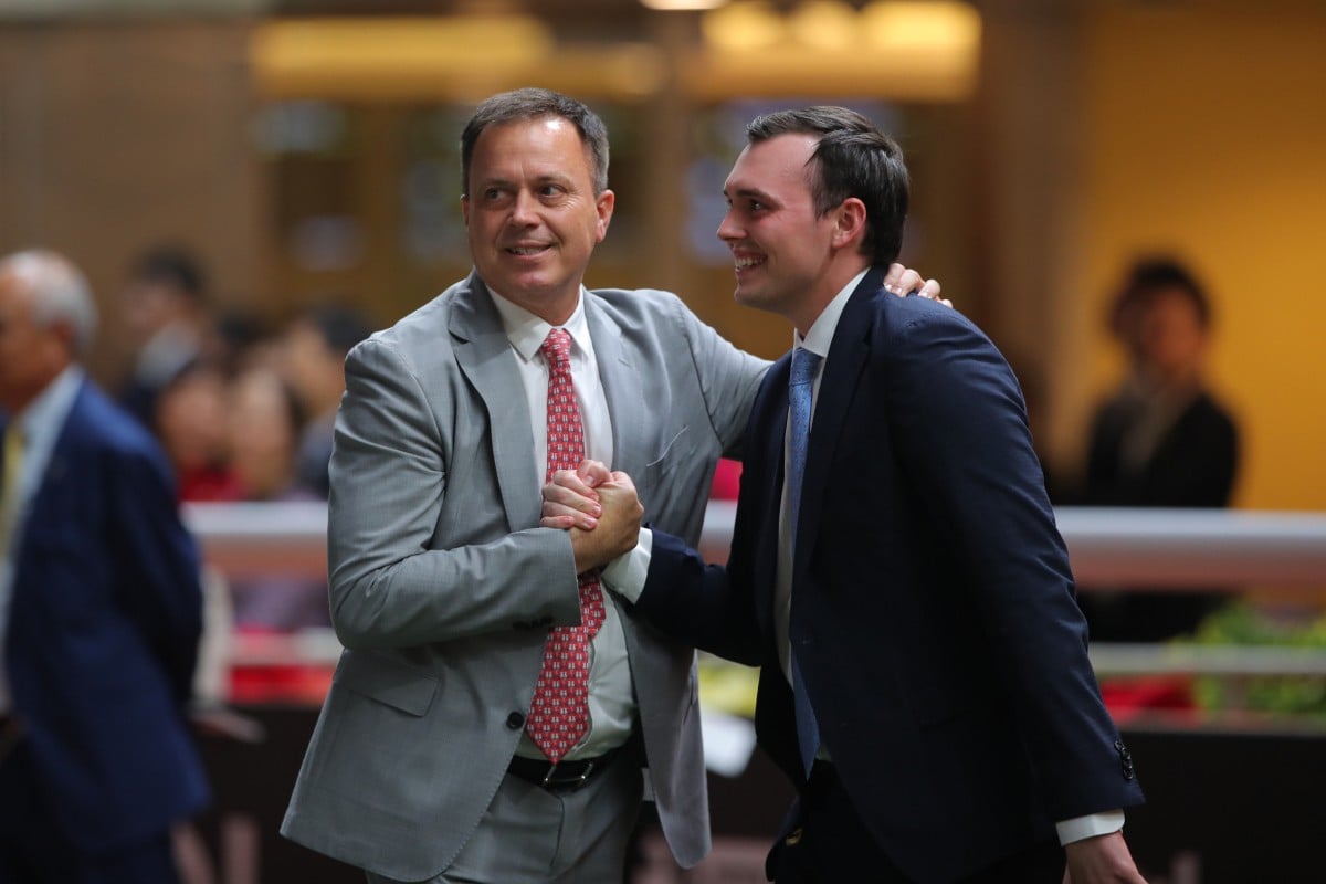Caspar Fownes celebrates a Happy Valley win with son Ronan. Photos: Kenneth Chan