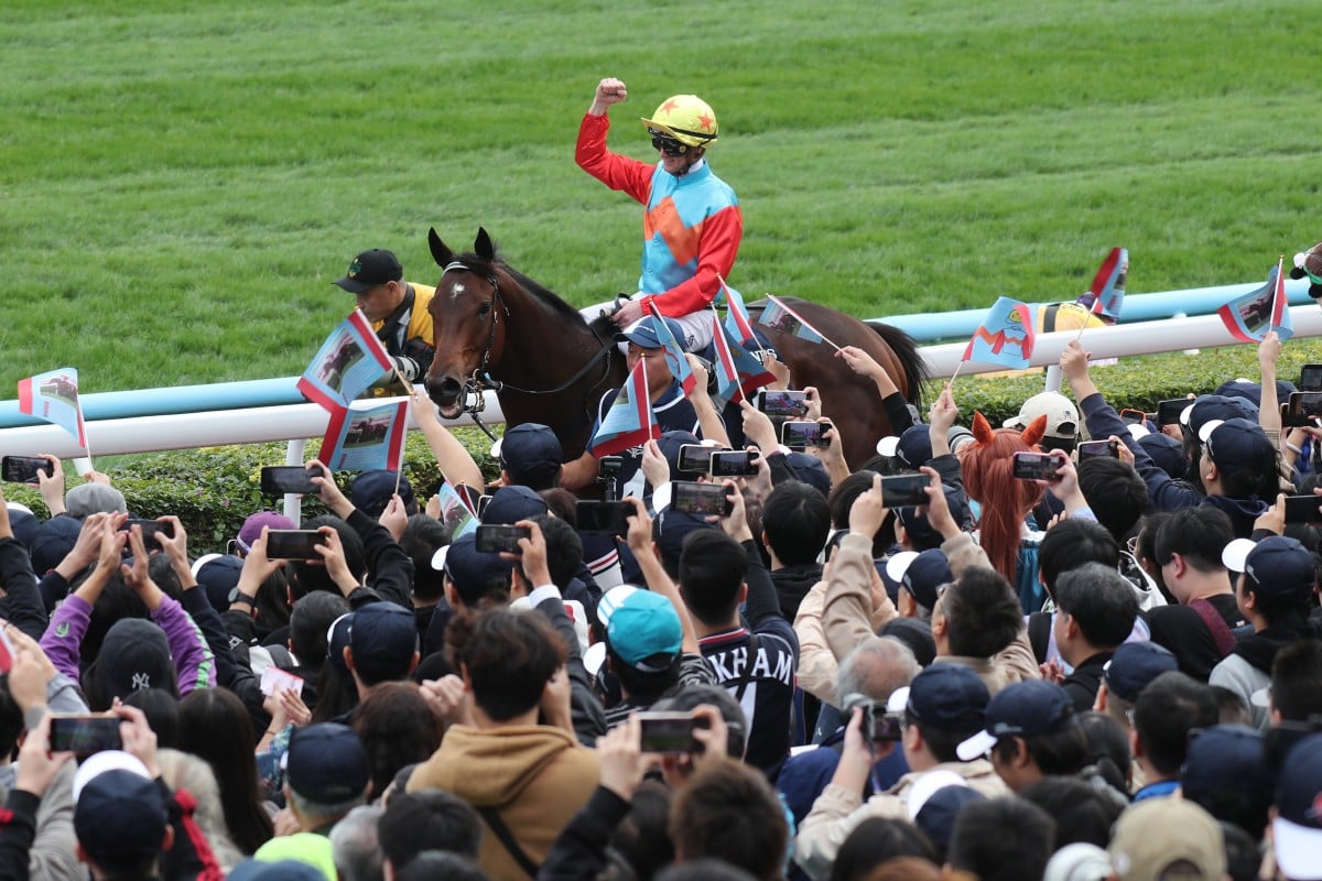 Jockey Zac Purton celebrates Ka Ying Rising’s Hong Kong Sprint success with fans at Sha Tin. Photos: Kenneth Chan