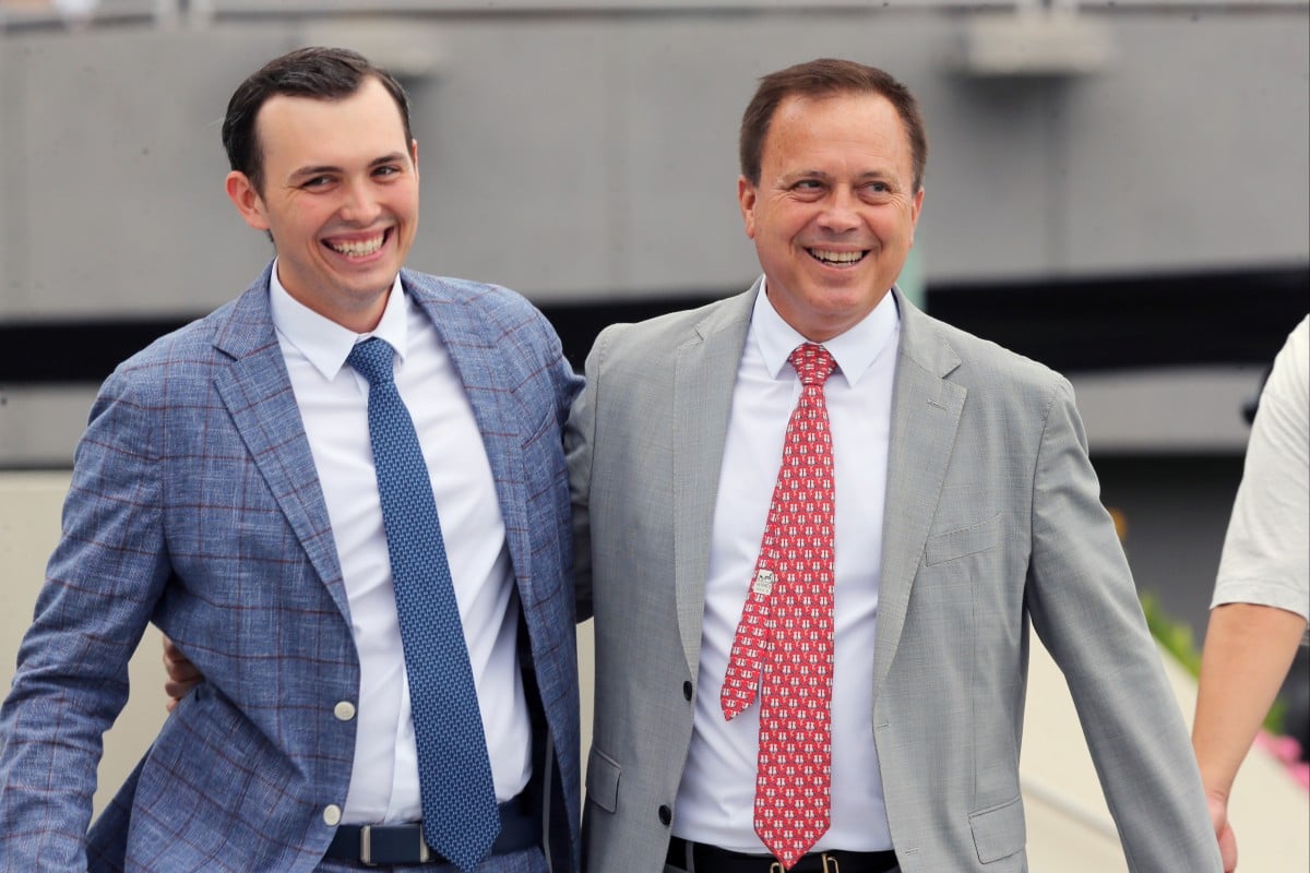 Caspar Fownes (right) and son Ronan celebrate the stable’s double at Sha Tin on Sunday. Photos: Kenneth Chan