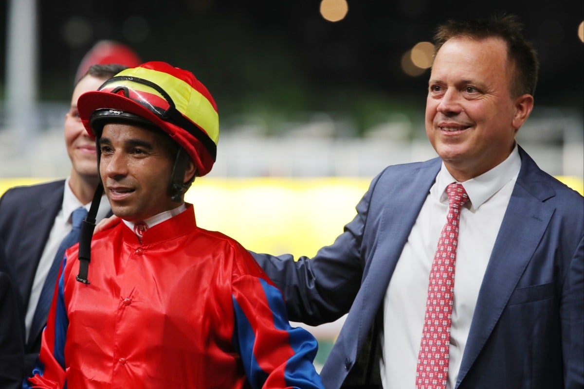 Caspar Fownes celebrates a Happy Valley victory with jockey Joao Moreira. Photos: Kenneth Chan