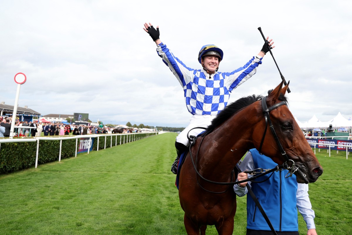 Saffie Osborne celebrates her record-breaking St Leger win on Highwayman. Photos: HKJC
