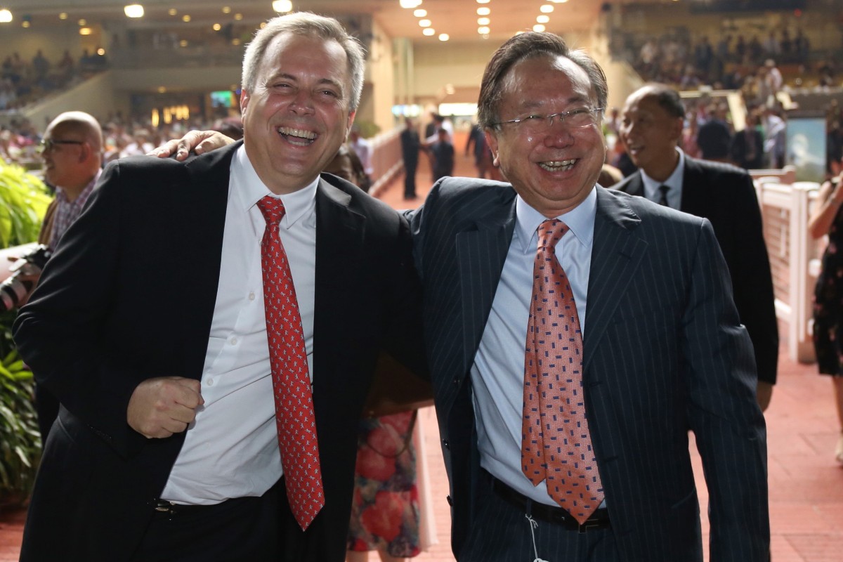Trainer Caspar Fownes celebrates the win of Southern Legend with owner Boniface Ho in Singapore. Photos: Kenneth Chan