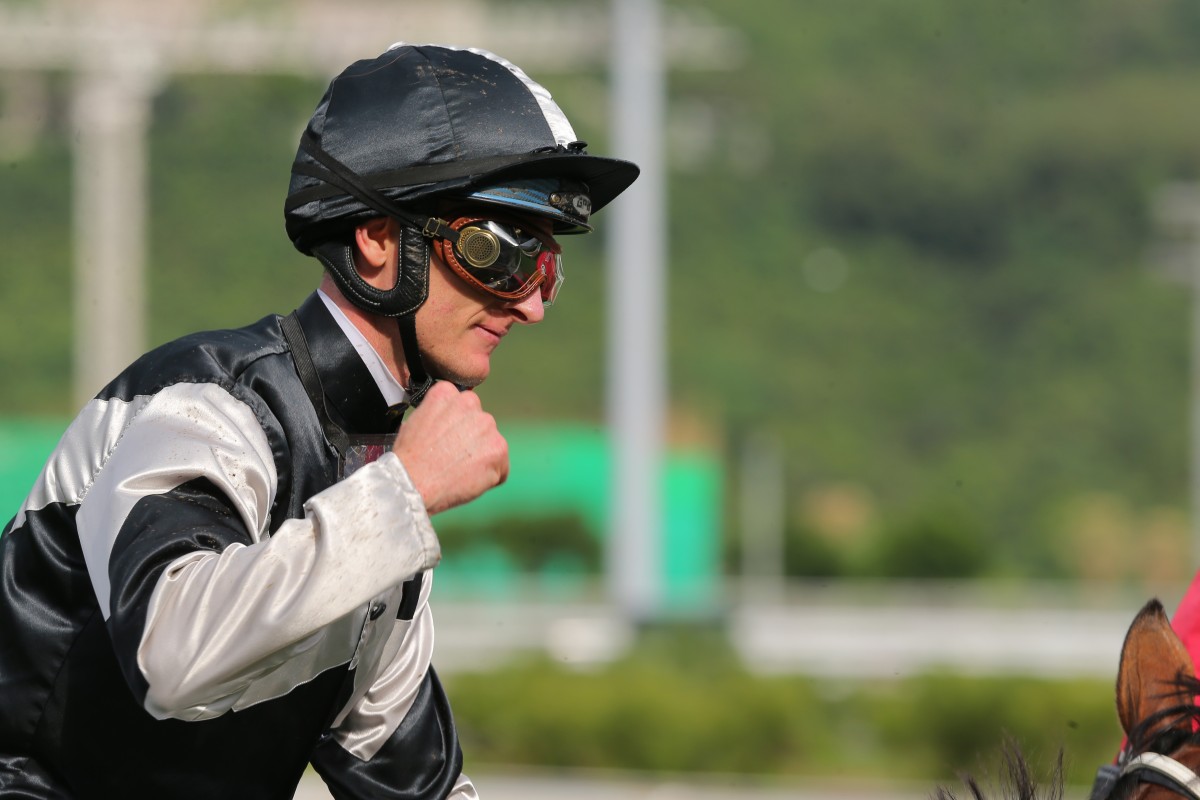 Zac Purton pumps his fist after winning aboard Exultant. Photos: Kenneth Chan